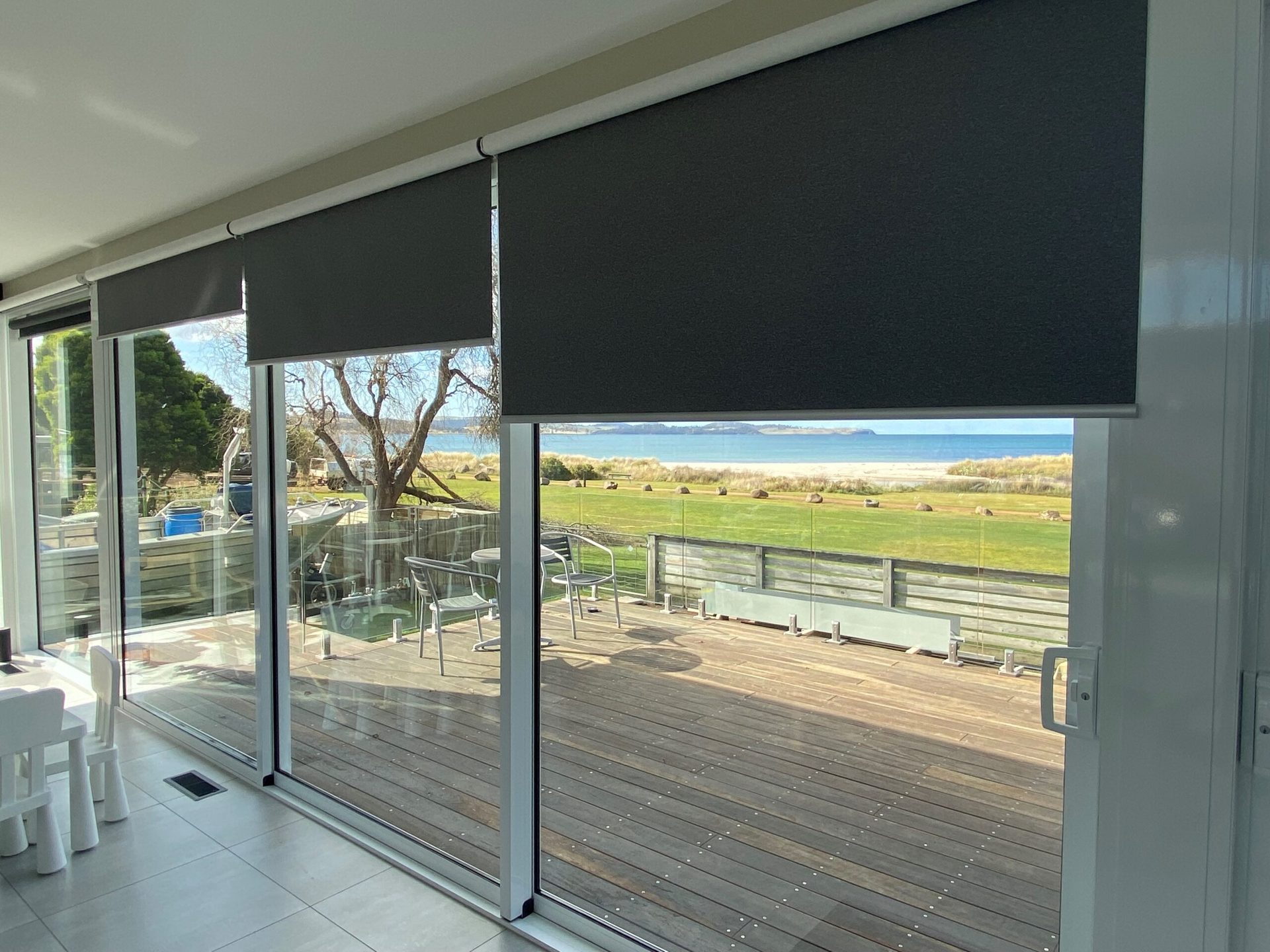 Blockout roller blinds across a bedroom window