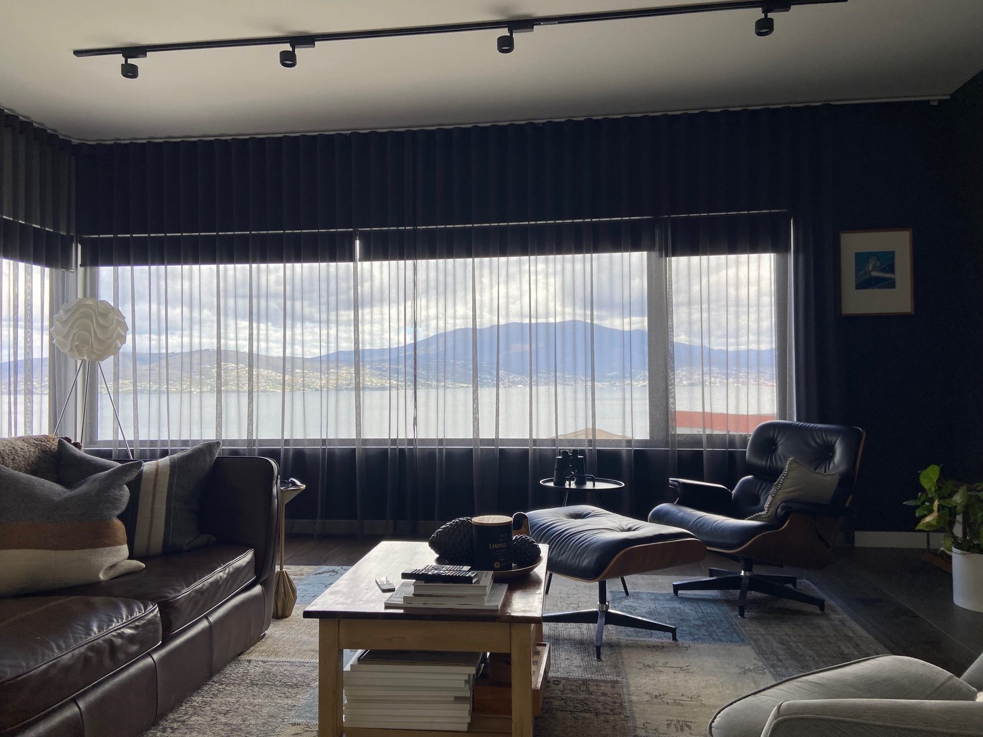 Sheer curtains behind a lounge suite in a living room